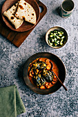 Baby aubergine curry with roti and cucumber sambal