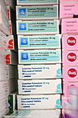 Stack of losartan potassium blood pressure tablet boxes