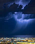 Lightning over a coastal town