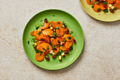 Warm carrot salad with apples, coriander and raisins