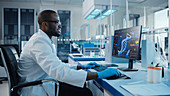 Scientist using a computer in a laboratory