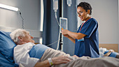 Nurse checking on elderly patient