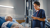 Nurse checking on elderly patient