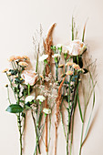 Different flowers: roses, chrysanthemums, carnations, amaranth, sea lavender, and grasses