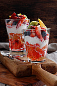 Summer dessert with jelly whipped cream and fruit