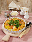 Sweet potato casserole with pecorino cheese and fresh rocket