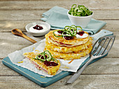 Hearty potato pancakes with ham and cranberries