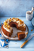 Carrot bundt cake with cream cheese maple syrup icing, candied ginger and walnuts