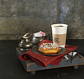 Sprinkle Donut On Silver Plate with Takeout Coffee, Cream and Sugar