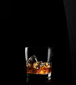 Whiskey on ice in glass