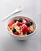 Millet porridge with almond butter and fresh berries