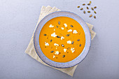 Sweet potato and pumpkin soup with turmeric and feta cheese