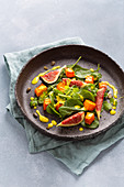 Pumpkin salad with spinach, figs and a turmeric dressing