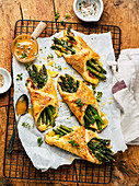 Asparagus puff pastry bags with cheese and thyme honey