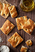 Sliced focaccia bread with salt and olive oil