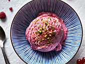 Raspberry ice cream with pistachios