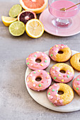 Blood orange glazed baked almond donuts decorated with heart shaped sprinkles