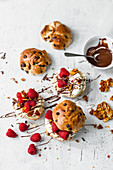 Chocolate burger with white cream, raspberries and brittle