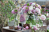 Easter bouquets with ranunculus and cuckoo carnations 'Petit Henry' 'Petit Jenny', Easter bunny, and Easter eggs