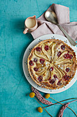 Pear and raspberry frangipane tart with cream