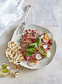 Spicy carpaccio with radishes