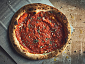Pizza alla marinara with oil, tomato sauce and oregano