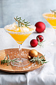 Snow martini with clementine juice and rosemary