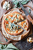 Pumpkin pizza with chicken and blue cheese