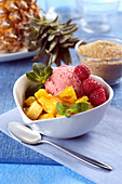Raspberry ice cream and fresh pineapple