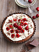 Chocolate pie with coconut and cherries