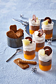 Striped dessert with caramel in glass