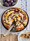 Yeast cake with plums and sliced almonds