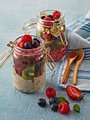 Porridge in glass with fruits and chia seeds