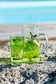 Chilled detox drink with fresh mint and salvia leaves