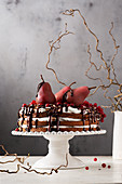 Naked cake with mascarpone cream, red wine pears and chocolate