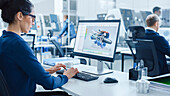 Engineer using CAD software on a computer