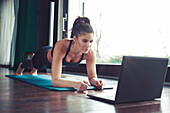 Woman doing online fitness class