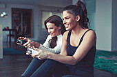 Women playing on games console