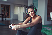 Woman playing on game console