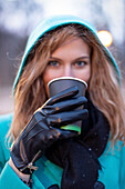 Woman walking with hot drink