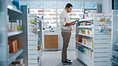 Customer using a smartphone in a pharmacy