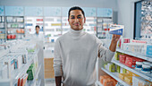 Customer holding a box of vitamins