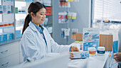 Pharmacist selling medication to a customer