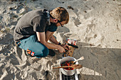 Man preparing food outdoors