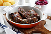 Beef roulades stuffed with pickled cucumber and paprika in sauce
