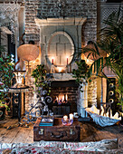 18th century fireplace with lime-washed exposed bricks and corset lampshade