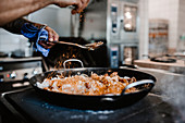 Chef preparing paella