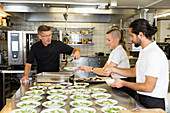 People working in restaurant kitchen