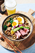 Ramen soup with roast beef and eggs (Asia)