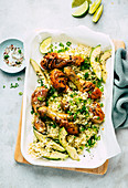 Roast chicken drumsticks with rice and avocado